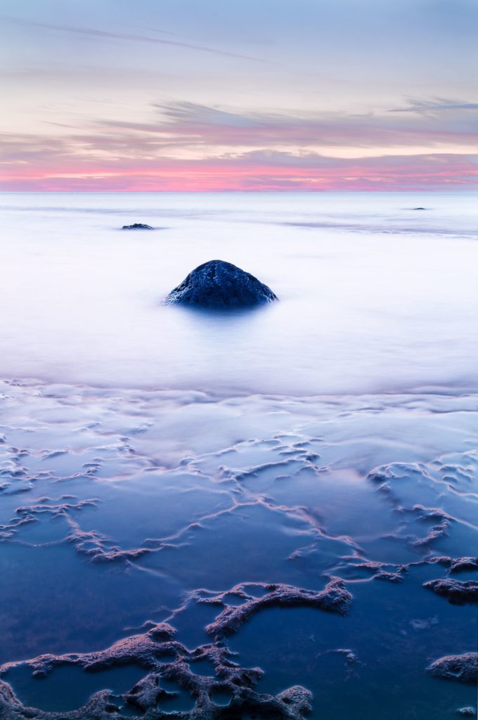 A long exposure of rock and water on the shore of Lake Huron