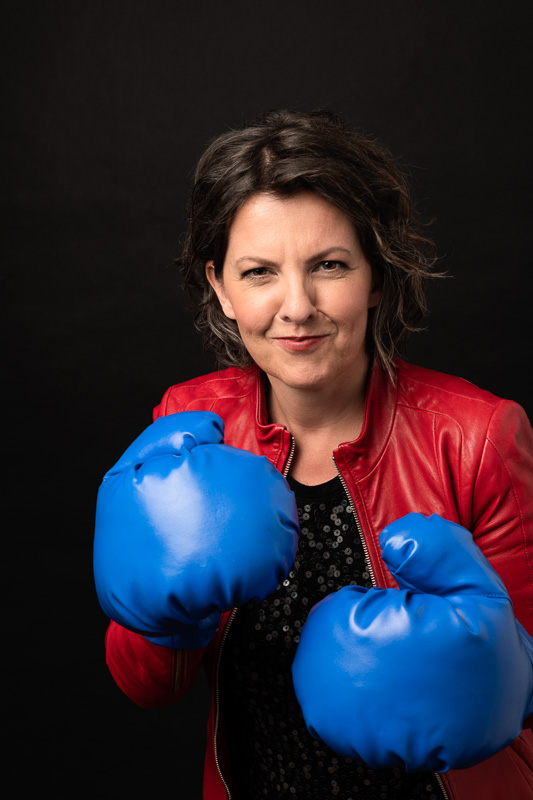 Woman with blue boxing gloves